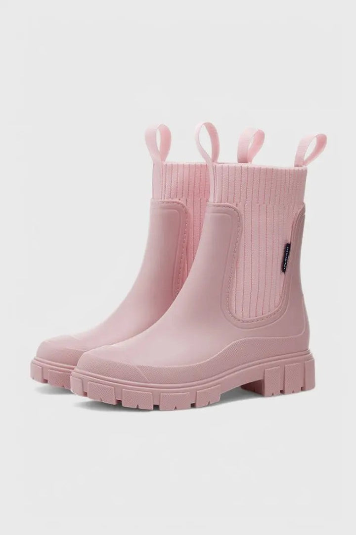 Pink Chelsea rain boots with ribbed ankle panel and chunky tread sole