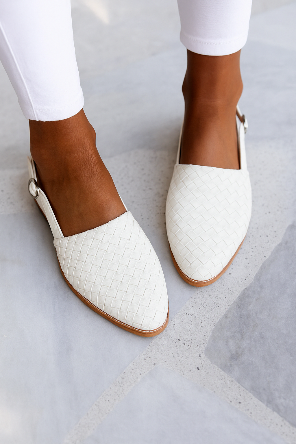 White woven leather flat sandal with pointed toe and buckle strap