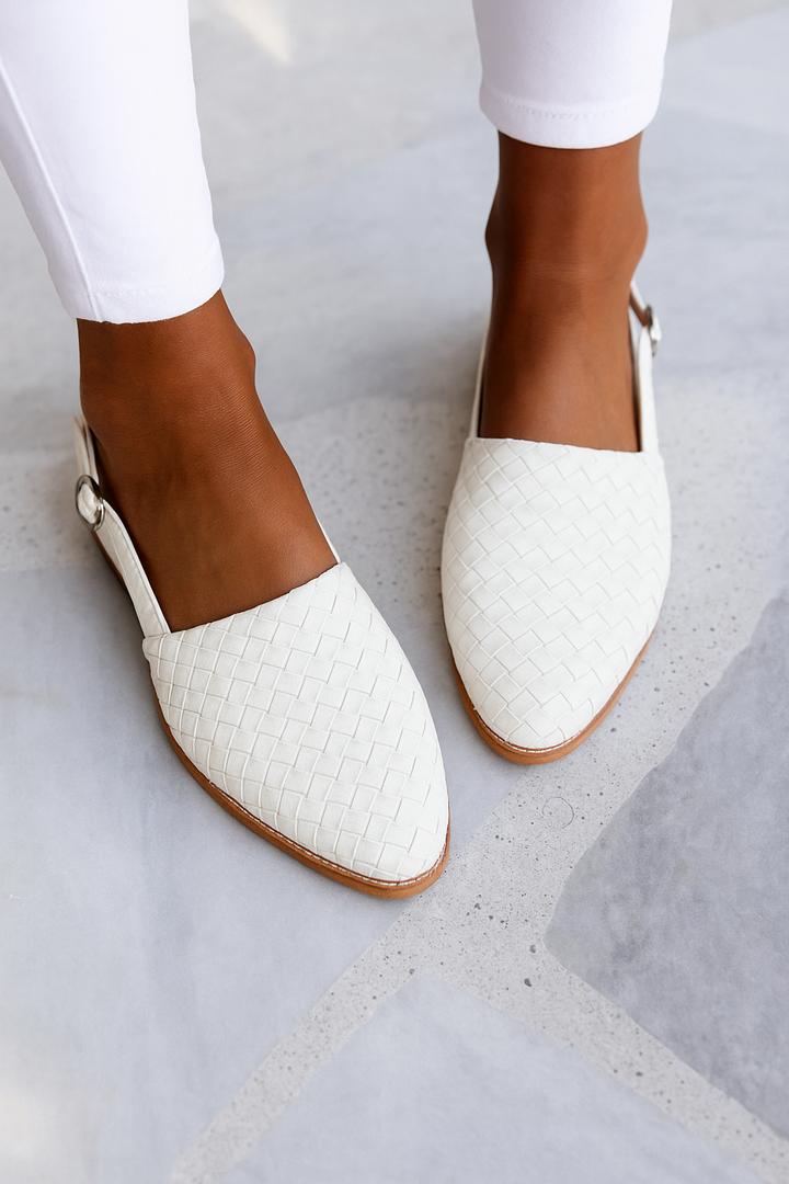 White woven leather flat sandal with pointed toe and buckle strap