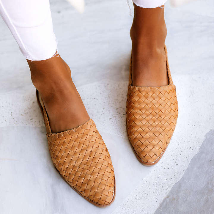 Tan woven leather pointed-toe flat sandal with slingback strap