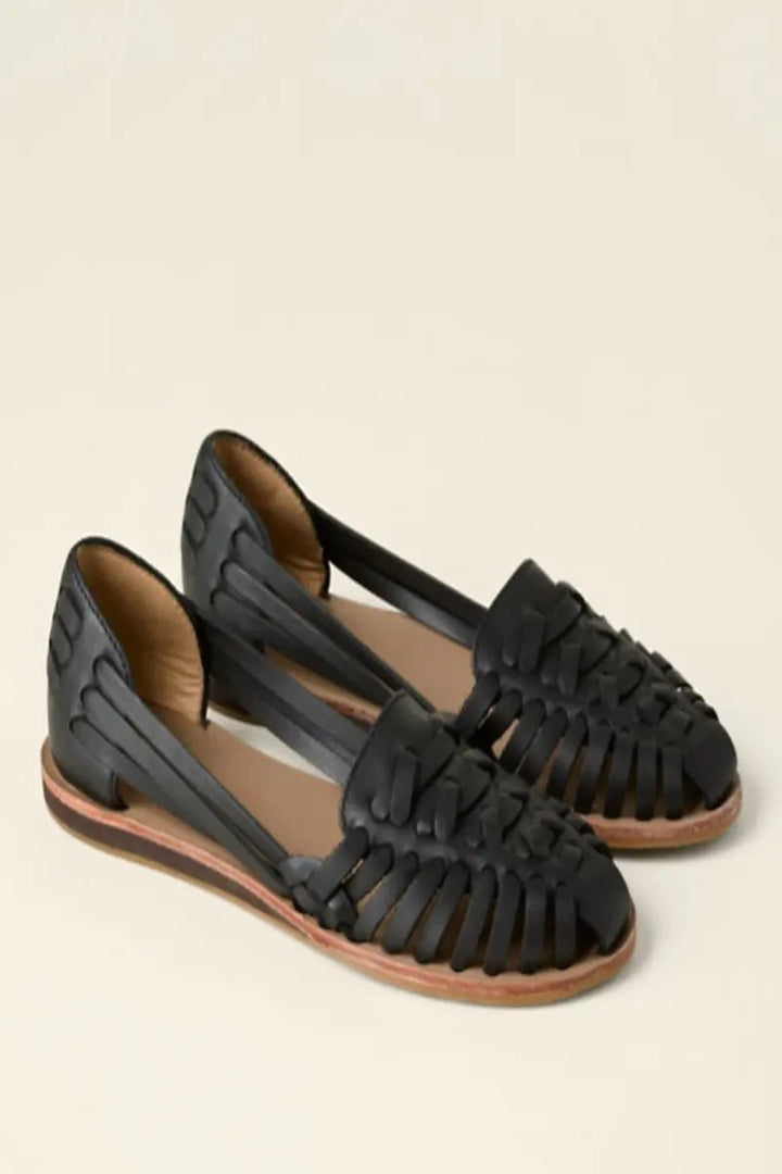 Black leather woven huarache sandals with slip-on style and subtle wedge heel