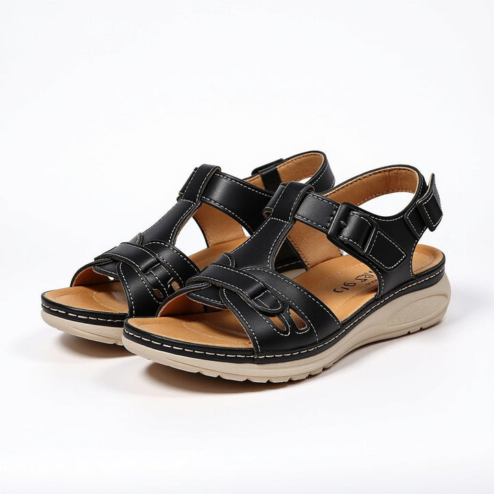 black woven T-bar sandals with buckle strap and contrast stitching on wedge sole