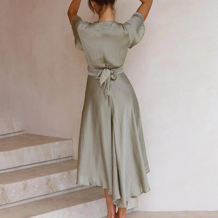 Rear view of sage green midi dress with tie waist and flutter sleeves