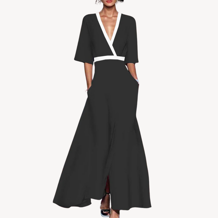Black wrap-style maxi dress with contrasting white V-neck trim and flared sleeves