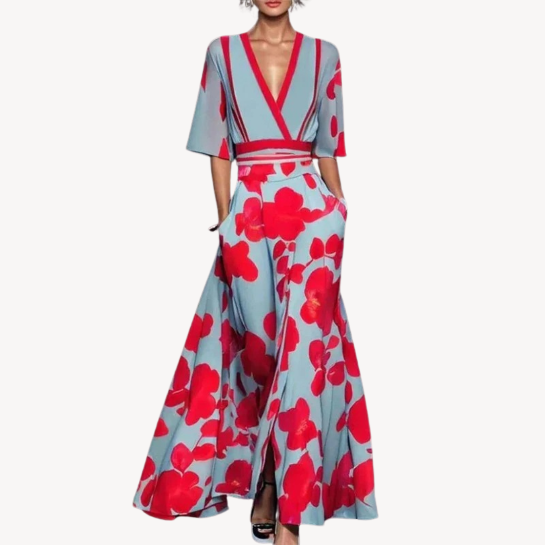 Sky blue maxi dress with bold red floral print and matching trim detailing