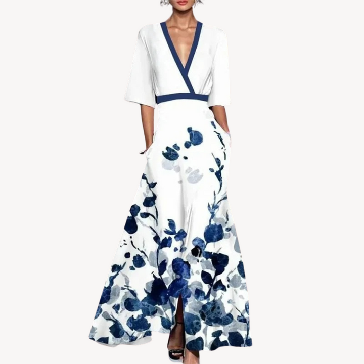 White maxi dress featuring watercolour blue floral design and V-neck wrap bodice
